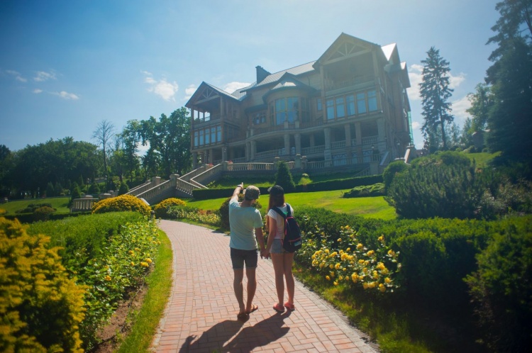 couple checking out new house from the outside